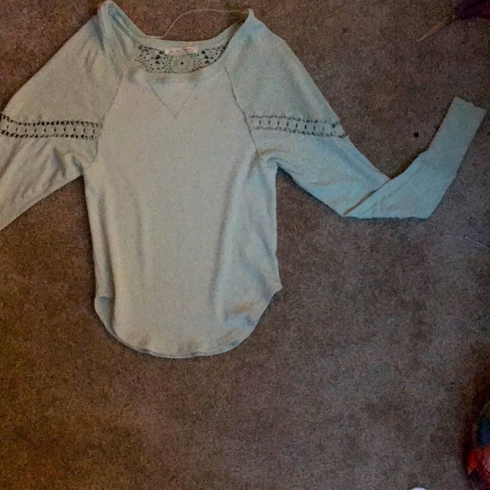 Tiffany blue long sleeve tee with lace cut outs and shoulder patches.